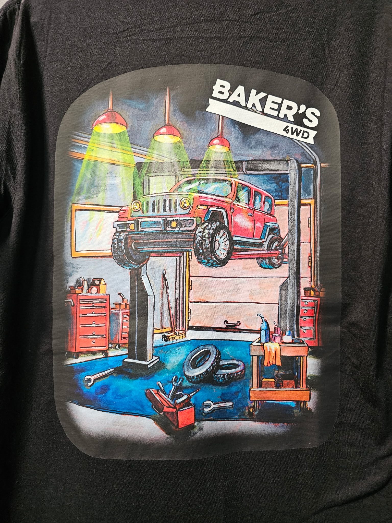 Back of Baker's 4WD shop-themed shirt available for sale